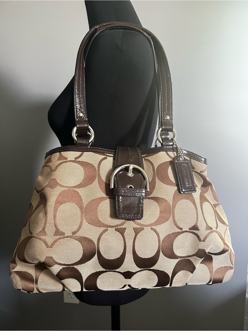 a Coach Soho Signature Buckle Flap Shoulder Bag F19253